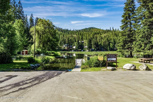 25400 N Lantern Hill Rd, Rathdrum, ID 83858 - view of property's community with a boat ramp, a forest view, and a water view