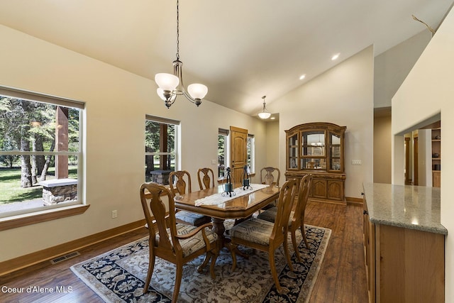 25400 N Lantern Hill Rd, Rathdrum, ID 83858 - dining area with dark wood-type flooring, a chandelier, and high vaulted ceiling