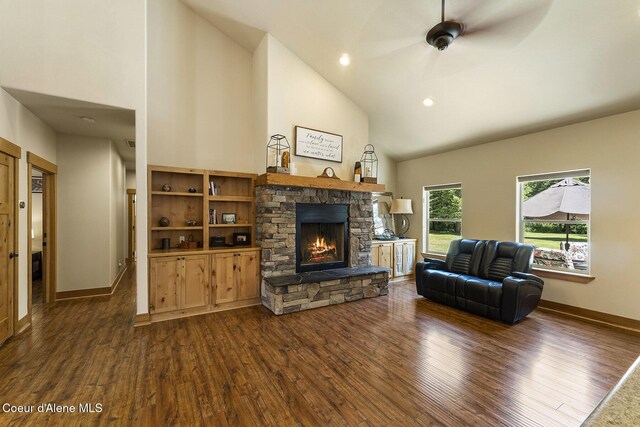 25400 N Lantern Hill Rd, Rathdrum, ID 83858 - living room featuring dark wood-style floors, a stone fireplace, high vaulted ceiling, ceiling fan, and recessed lighting
