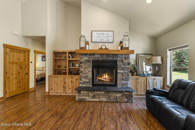 25400 N Lantern Hill Rd, Rathdrum, ID 83858 - living room featuring high vaulted ceiling, wood finished floors, and a fireplace