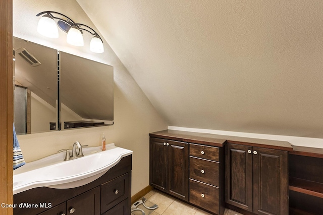 25400 N Lantern Hill Rd, Rathdrum, ID 83858 - bathroom with lofted ceiling, vanity, and tile patterned floors
