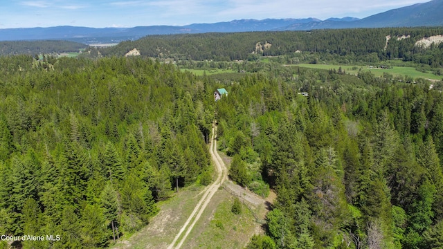 859 Otter Ln, Bonners Ferry, ID 83805 - aerial view of a heavily wooded area and a mountain backdrop