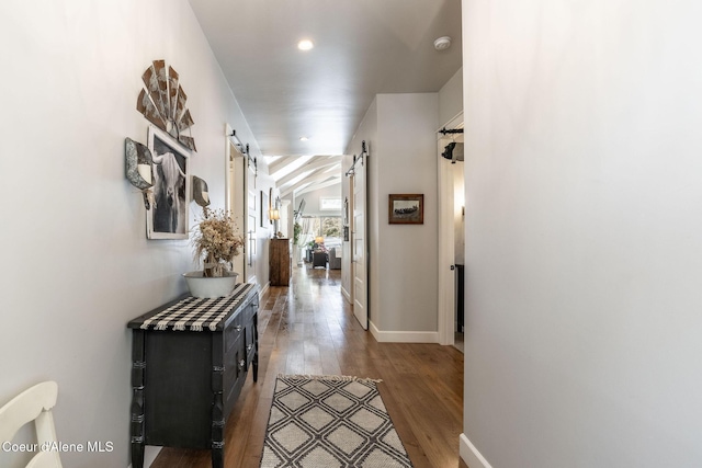 10383 N Morris Rd, Hayden Lake, ID 83835 - corridor featuring a barn door, wood finished floors, and baseboards