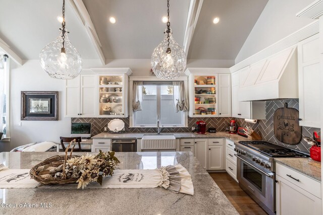 10383 N Morris Rd, Hayden Lake, ID 83835 - kitchen featuring appliances with stainless steel finishes, a sink, light stone countertops, lofted ceiling, and white cabinetry