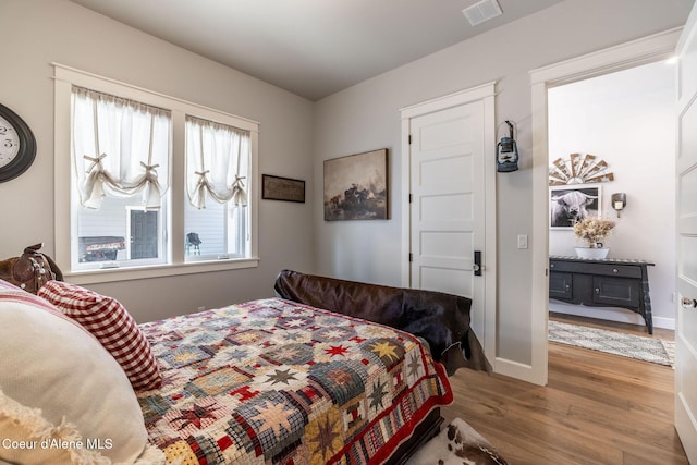 10383 N Morris Rd, Hayden Lake, ID 83835 - bedroom featuring wood finished floors and baseboards