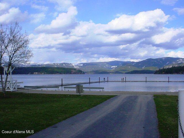 10383 N Morris Rd, Hayden Lake, ID 83835 - water view with a mountain backdrop and a dock