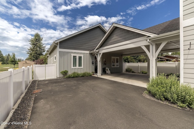 10383 N Morris Rd, Hayden Lake, ID 83835 - view of front of property with board and batten siding and driveway