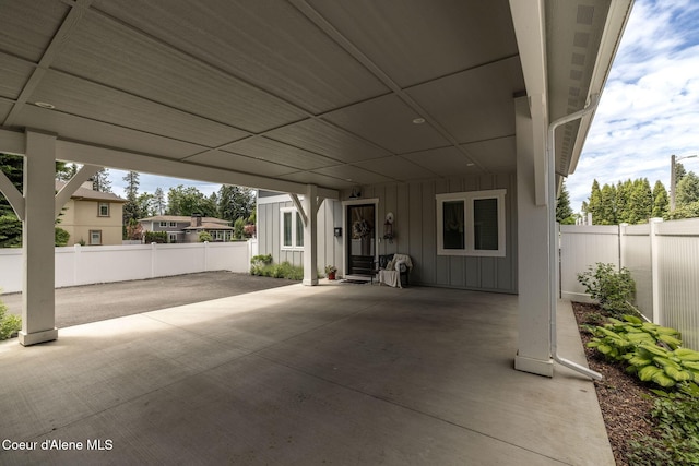 10383 N Morris Rd, Hayden Lake, ID 83835 - fenced backyard featuring a carport and a patio