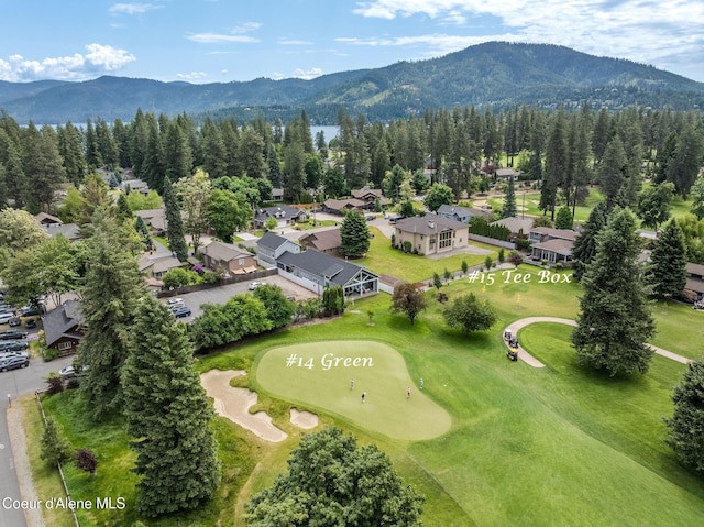 10383 N Morris Rd, Hayden Lake, ID 83835 - drone / aerial view of a mountain backdrop, a forest, and a local golf course