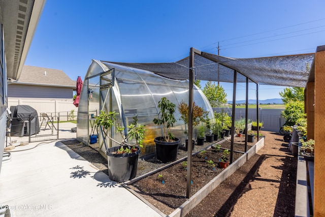 4281 N Shelburne Loop, Post Falls, ID 83854 - fenced backyard featuring an exterior structure, a garden, an outdoor structure, grilling area, and a gate