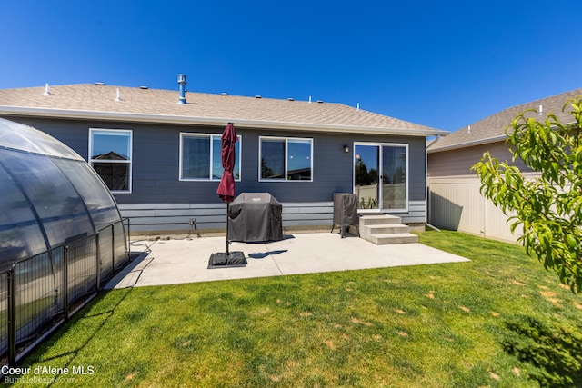 4281 N Shelburne Loop, Post Falls, ID 83854 - rear view of house featuring a patio area, a yard, and a shingled roof