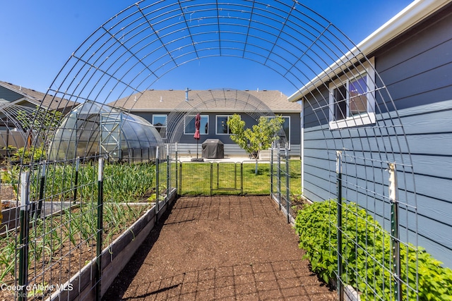 4281 N Shelburne Loop, Post Falls, ID 83854 - view of patio featuring a vegetable garden and an exterior structure
