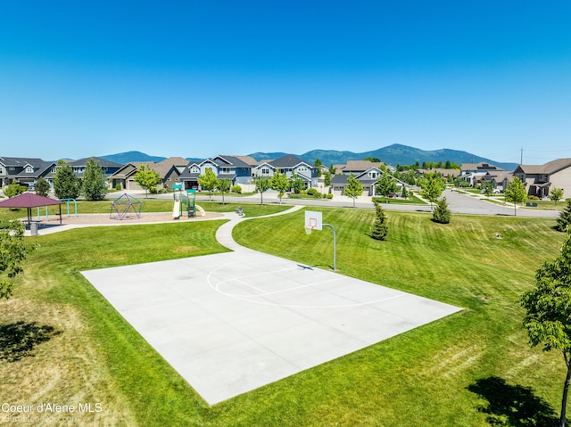 4281 N Shelburne Loop, Post Falls, ID 83854 - view of home's community with a residential view, a yard, a mountain view, and community basketball court