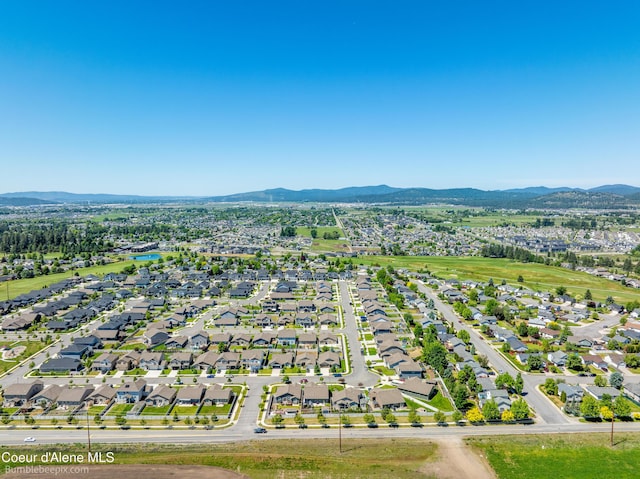4281 N Shelburne Loop, Post Falls, ID 83854 - aerial perspective of suburban area with a mountain backdrop