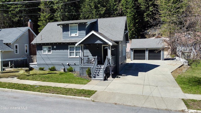 124 King St, Wallace, ID 83873 - view of front of home with an outdoor structure and a front yard