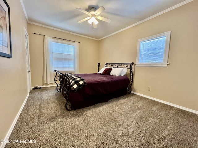 124 King St, Wallace, ID 83873 - bedroom with ornamental molding, carpet floors, baseboards, and a ceiling fan