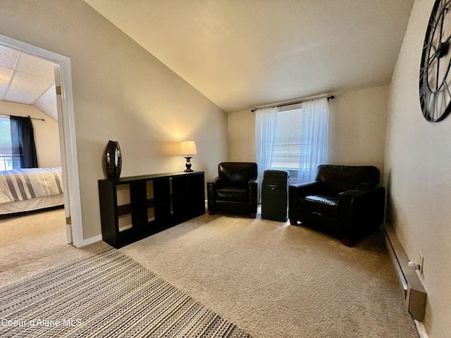 124 King St, Wallace, ID 83873 - living area featuring carpet, vaulted ceiling, and baseboards