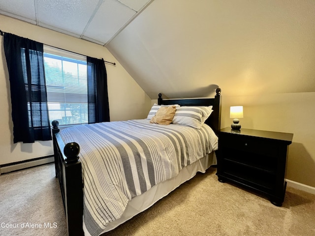 124 King St, Wallace, ID 83873 - bedroom featuring carpet floors, baseboard heating, vaulted ceiling, and baseboards