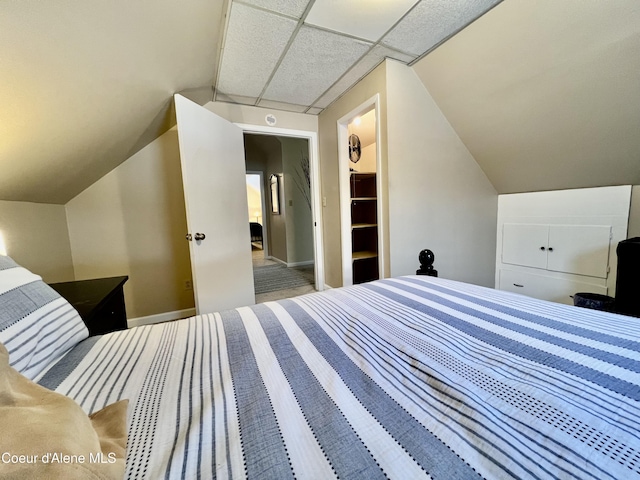 124 King St, Wallace, ID 83873 - bedroom featuring vaulted ceiling, baseboards, and carpet flooring