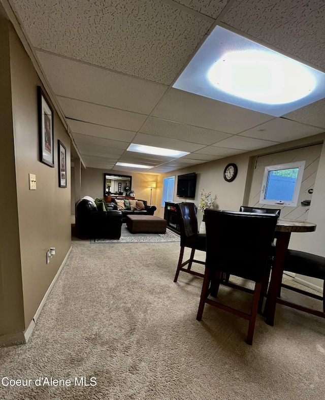 124 King St, Wallace, ID 83873 - carpeted dining room featuring a drop ceiling and baseboards