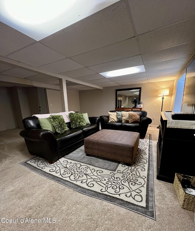 124 King St, Wallace, ID 83873 - carpeted living area featuring a drop ceiling