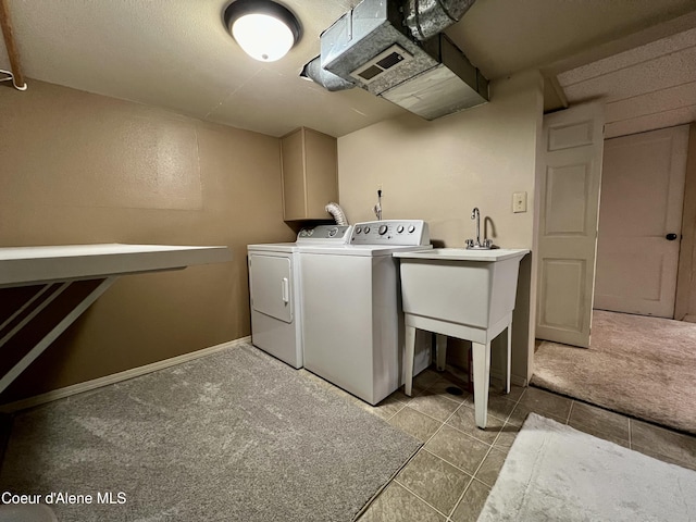 124 King St, Wallace, ID 83873 - laundry area with independent washer and dryer, light colored carpet, and light tile patterned floors