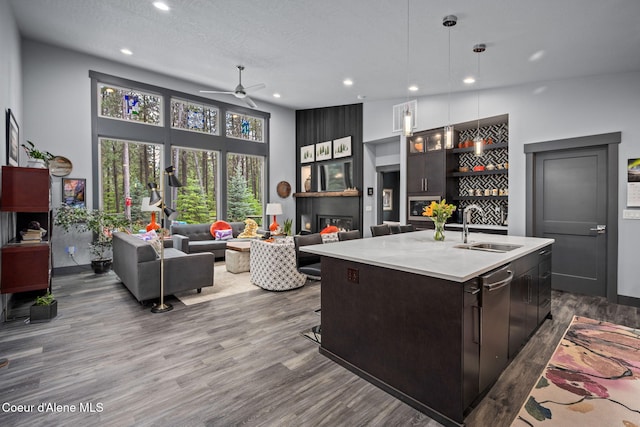 6036 W Sparrowhawk Dr, Rathdrum, ID 83858 - kitchen with a sink, ceiling fan, light countertops, recessed lighting, and dark wood finished floors