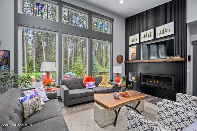 6036 W Sparrowhawk Dr, Rathdrum, ID 83858 - living area featuring a high ceiling, a fireplace, and recessed lighting