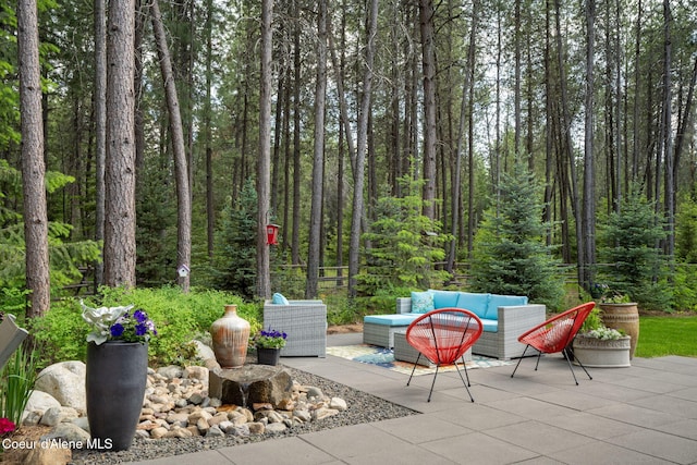 6036 W Sparrowhawk Dr, Rathdrum, ID 83858 - view of patio / terrace with outdoor lounge area and a forest view