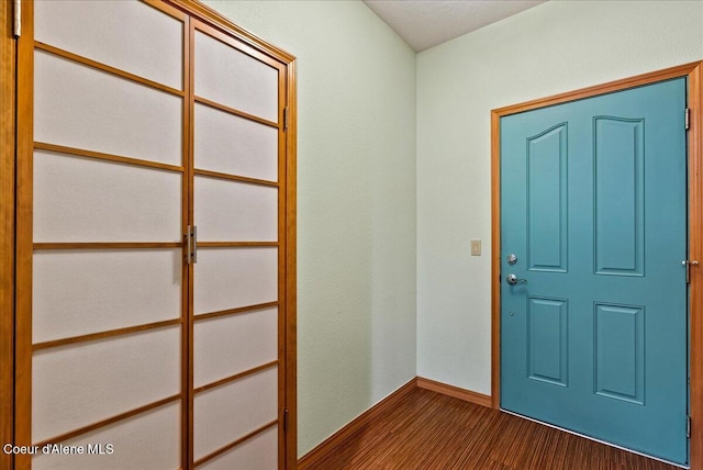 1010 E Mullan Ave Unit 202, Coeur Dalene, ID 83814 - entrance foyer featuring baseboards and dark colored carpet