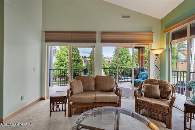 1010 E Mullan Ave Unit 202, Coeur Dalene, ID 83814 - living room with vaulted ceiling, carpet, and baseboards
