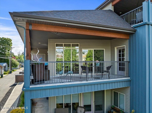 1010 E Mullan Ave Unit 202, Coeur Dalene, ID 83814 - view of property exterior with a shingled roof