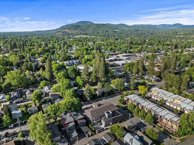 1010 E Mullan Ave Unit 202, Coeur Dalene, ID 83814 - view of property location with a heavily wooded area, a mountainous background, and nearby suburban area