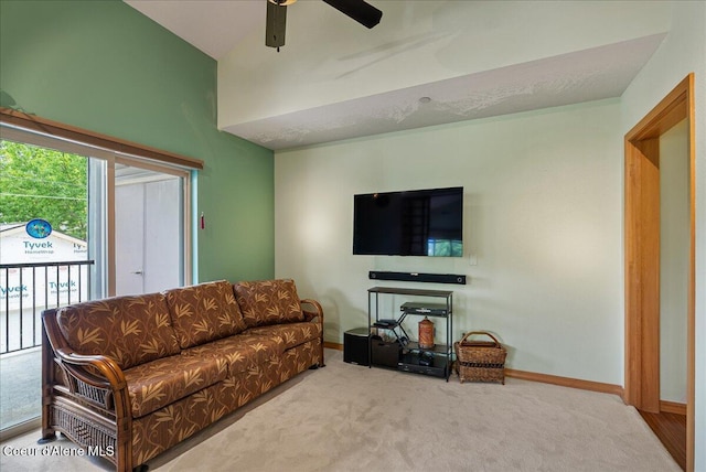 1010 E Mullan Ave Unit 202, Coeur Dalene, ID 83814 - living room featuring carpet flooring, ceiling fan, baseboards, and high vaulted ceiling