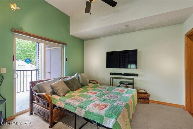 1010 E Mullan Ave Unit 202, Coeur Dalene, ID 83814 - bedroom featuring access to outside, light carpet, baseboards, ceiling fan, and lofted ceiling