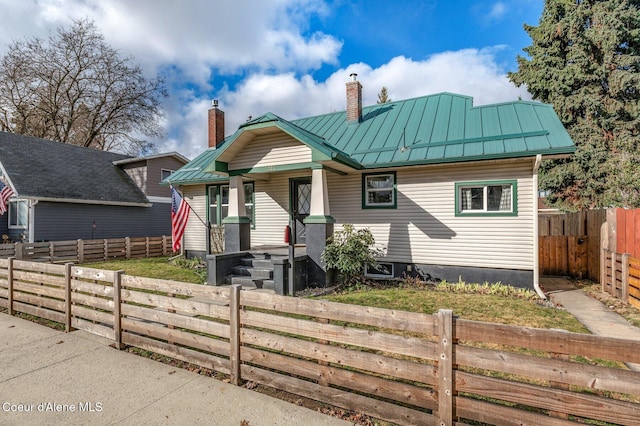 721 N A St, Coeur Dalene, ID 83814 - bungalow featuring a chimney, a porch, a standing seam roof, and metal roof