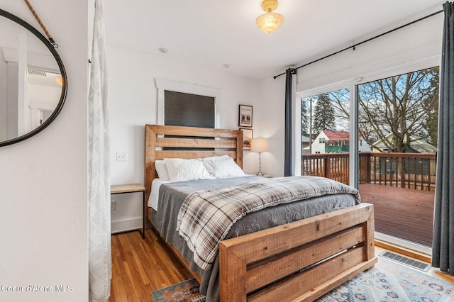 721 N A St, Coeur Dalene, ID 83814 - bedroom featuring access to outside and wood finished floors