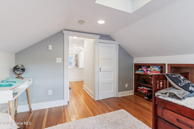 721 N A St, Coeur Dalene, ID 83814 - bedroom with light wood-style floors, baseboards, and lofted ceiling