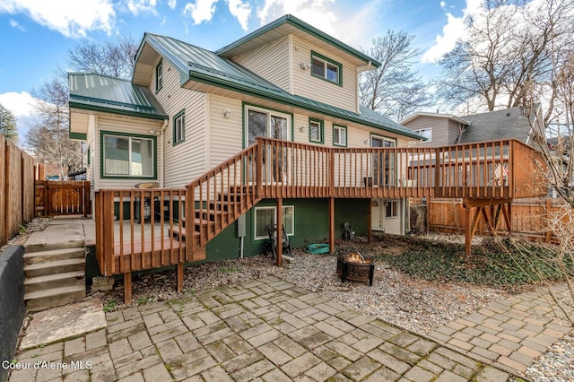 721 N A St, Coeur Dalene, ID 83814 - back of property featuring stairway, a deck, and an outdoor fire pit