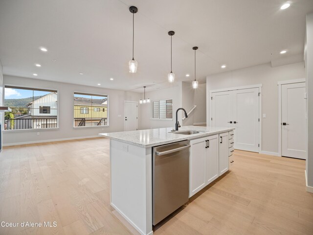 997 E Railroad Ave, Post Falls, ID 83854 - kitchen with dishwasher, a sink, light wood-style floors, an island with sink, and recessed lighting