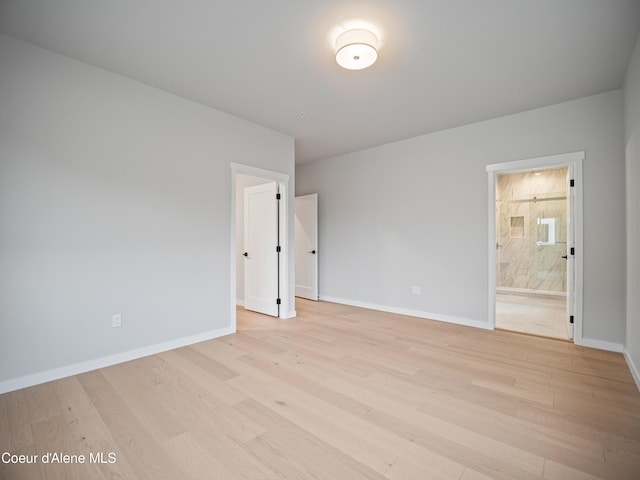 997 E Railroad Ave, Post Falls, ID 83854 - empty room with light wood-type flooring and baseboards