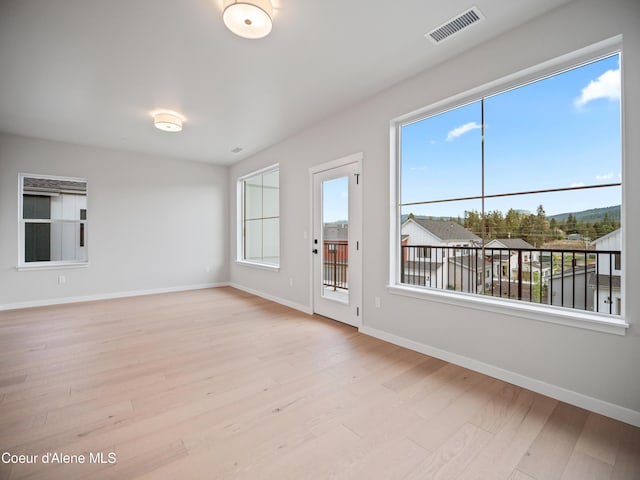 997 E Railroad Ave, Post Falls, ID 83854 - unfurnished room with light wood finished floors, plenty of natural light, and baseboards