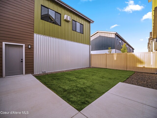 997 E Railroad Ave, Post Falls, ID 83854 - view of yard featuring a patio and a wall mounted air conditioner