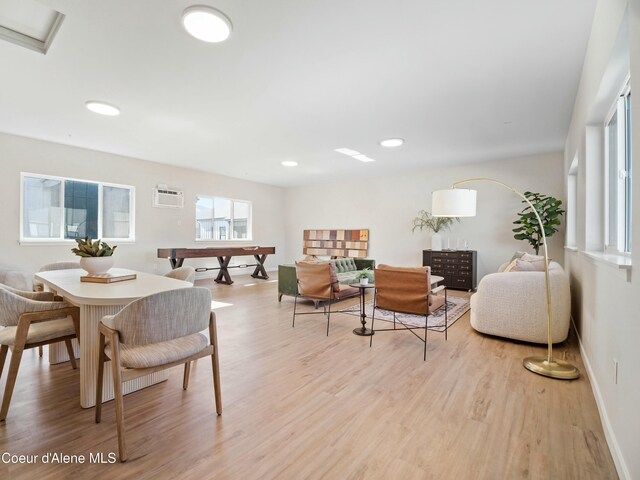1031 E Railroad Ave, Post Falls, ID 83854 - dining room featuring wood finished floors, recessed lighting, baseboards, and an AC wall unit
