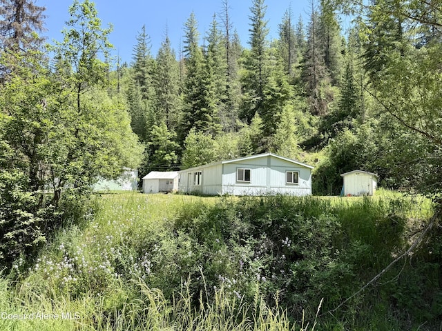 1068 Moon Gulch Rd, Kellogg, ID 83837 - view of side of home featuring a view of trees