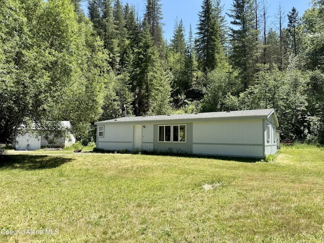 1068 Moon Gulch Rd, Kellogg, ID 83837 - back of property featuring a yard and an outdoor structure