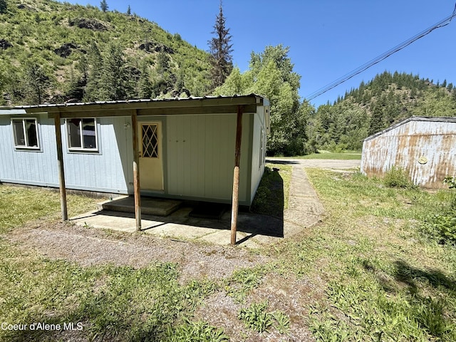 1068 Moon Gulch Rd, Kellogg, ID 83837 - view of outbuilding with a wooded view and a mountain view