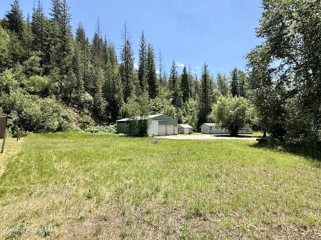 1068 Moon Gulch Rd, Kellogg, ID 83837 - view of yard with a detached garage and an outdoor structure