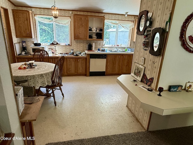 1068 Moon Gulch Rd, Kellogg, ID 83837 - kitchen with dishwasher, brown cabinets, open shelves, light countertops, and light flooring