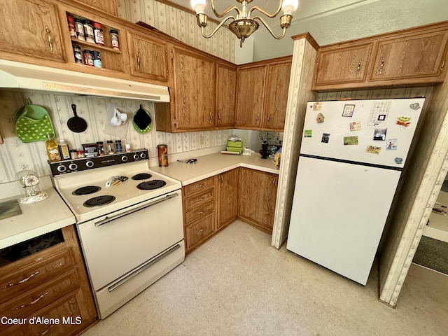 1068 Moon Gulch Rd, Kellogg, ID 83837 - kitchen featuring white appliances, under cabinet range hood, a chandelier, light countertops, and brown cabinets